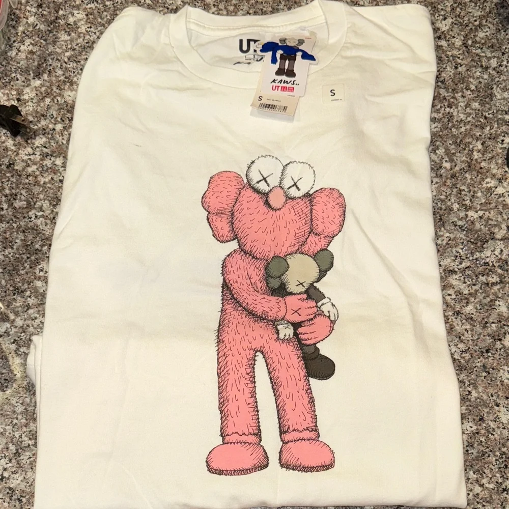 KAWS White Tee with Pink and Gray Graphic - Picture 1 of 3